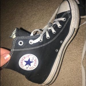 High top black Converse shoes